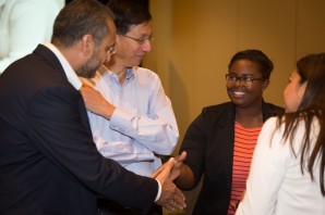 SanDisk Senior Vice President Gursharan Singh shakes hands with Kayla Tabb, a 2013 alum of E2@MIT and MIT freshman. SanDisk leadership traveled to the event from across the globe – Singh’s manufacturing and supply chain operations role is based in India.