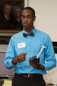Student Samuel Zinga of Loganville, Georgia, uses a model to demonstrate how wind turbines generate energy.
